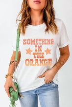 White t shirt with orange text and stars in basic style