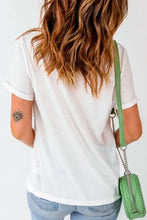 Slightly stretchy white v-neck t-shirt with pink checkered heart, rolled sleeves, mint green bag
