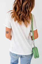 White and green crossbody bag with chain strap and pink cowboy graphics