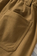 Tan corduroy wide-leg pants in mustard yellow, olive green, and brown
