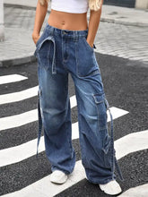 Blue denim wide leg cargo jeans featuring multiple pockets and a relaxed fit for casual wear