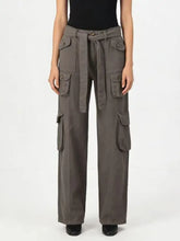 Dark gray wide leg cargo jeans with multiple pockets and matching belt tied at the waist for practical style