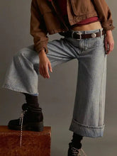 Light-wash denim wide-leg cropped jeans with rolled cuffs and classic five-pocket design for casual wear