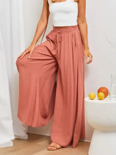 Coral high-waisted wide-leg pants with drawstring waistband and pockets