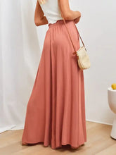 Dusty rose peach wide-leg drawstring pants with pockets and pleats