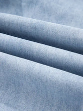 Light blue denim wide leg drawstring jeans with raw hem and subtle stitching details in soft worn fabric