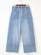 Light-wash wide leg drawstring jeans with elastic waistband and raw hem frayed denim wide leg drawstring pants