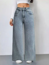 Light-wash denim wide leg high waist jeans with a classic five-pocket design and button closure