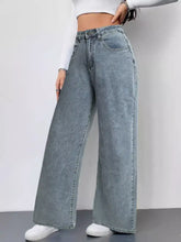Wide leg high waist jeans in faded light blue denim with classic stitching and front pockets