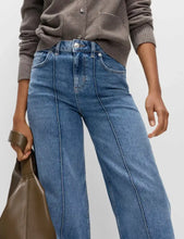 Mid-wash blue denim wide-leg jeans with high-rise fit straight-leg cut and visible front seam detail