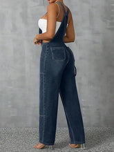 Dark wash wide leg strap denim overalls with front zipper and white crop top