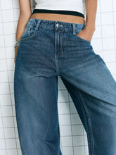 High-waisted blue denim wide leg washed jeans with relaxed fit and classic stitching details
