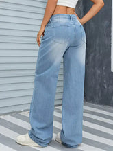 Light-wash wide leg washed jeans featuring a wide leg cut and classic back pockets shown from the back side