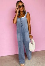 Light blue wide strap denim overalls with pockets and white top