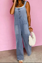 Wide strap denim overalls with light-wash fabric, front buttons and patch pockets