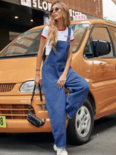 Women’s wide strap wide leg denim overalls with white crop top