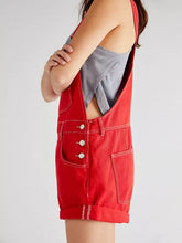 Red wide strap square neck denim overalls with white stitching and buttons