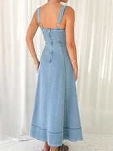Light blue denim dress with thin straps and back zipper showcasing wide strap sweetheart neck design back view