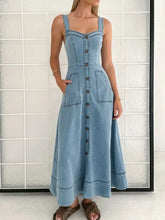 Light blue denim dress with wide strap sweetheart neck, button-front closure, and patch pockets in maxi style