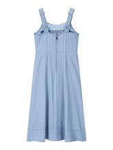 A light blue denim dress with wide strap sweetheart neck and adjustable shoulder straps featuring a front zipper