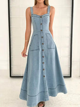 Light blue denim dress with wide strap sweetheart neck, square shoulder straps, and front button closure