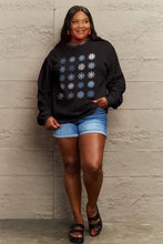 Plus size womens black round neck sweatshirt with blue and white snowflakes