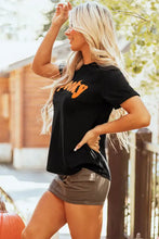 Womens black spooky t shirt with orange text and Nike swoosh