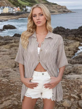 Women’s collared neck knit top with eyelet detailing and moderate stretch