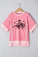 Pink women’s rodeo graphic casual loose fit sweatshirt on hanger