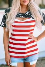 Woman in cutout striped round neck short sleeve American Flag Top with denim shorts