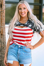 Woman in striped round neck short sleeve American flag top and denim shorts