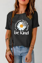 Black womens graphic round neck short sleeve t-shirt with daisy and be kind text