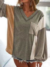 Women’s color block long-sleeve V-neck top with exposed seam chest pocket