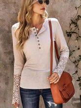 Women’s long sleeve henley shirt with lace cuffs and button round neck