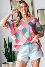 Multi colored argyle pattern slit t-shirt with denim shorts