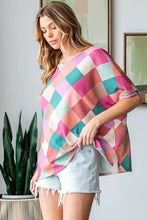 Womens multi colored argyle pattern short sleeve slit t-shirt with frayed hem