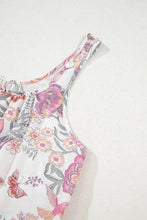 White floral tank top with butterfly accents and ruffled neckline