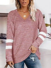 Womens pink long-sleeve raglan top with white stripes on sleeves
