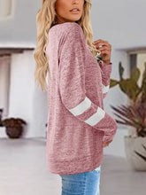 Womens pink long sleeve raglan top with white stripes on sleeves