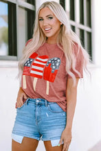 Woman in short sleeve flag round neck t-shirt and denim shorts