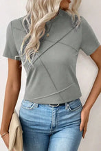 Light gray women’s solid color round neck short sleeve T-shirt with moderate stretch and asymmetrical seam