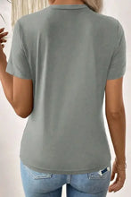 Women’s solid color round neck short sleeve t-shirt in gray with moderate stretch
