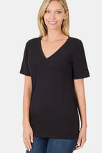 Woman modeling black v-neck short sleeve t-shirt for everyday wear
