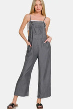 Women’s washed adjustable strap wide leg denim overalls with white camisole