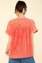 Women’s washed knit fabric short sleeve top in peach acid wash with pleated back