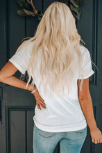 Womens white mama graphic t-shirt with rolled-up sleeves and distressed jeans