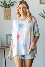 Womens oversized multi colored star print t-shirt with rolled sleeves and denim shorts