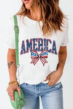 Womens white patriotic design t-shirt with America text and floral bow