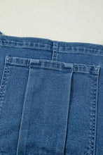 Women’s wide leg denim overalls with adjustable tie straps and pleats