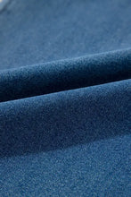 Women’s wide leg denim overalls with adjustable tie straps in blue wash fabric